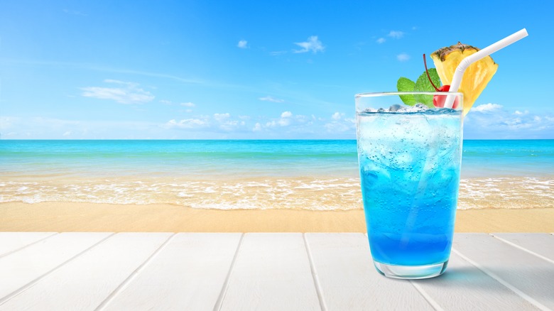 blue Hawaiian cocktail on beach