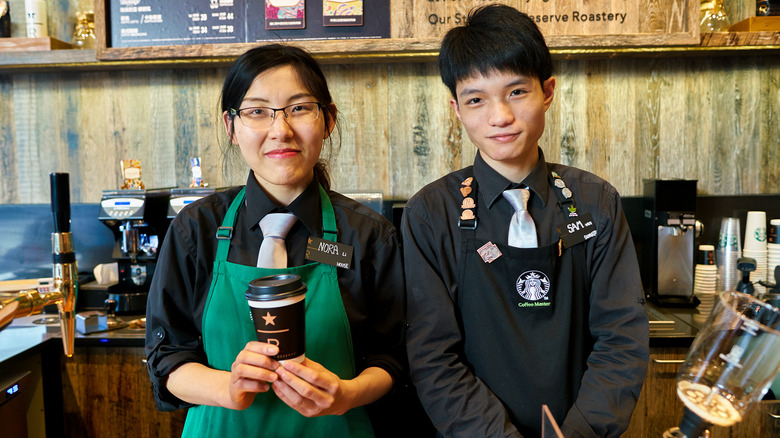 Smiling Starbucks employees