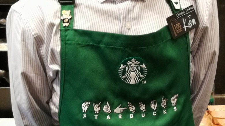 Starbucks apron with ASL fingerspelling