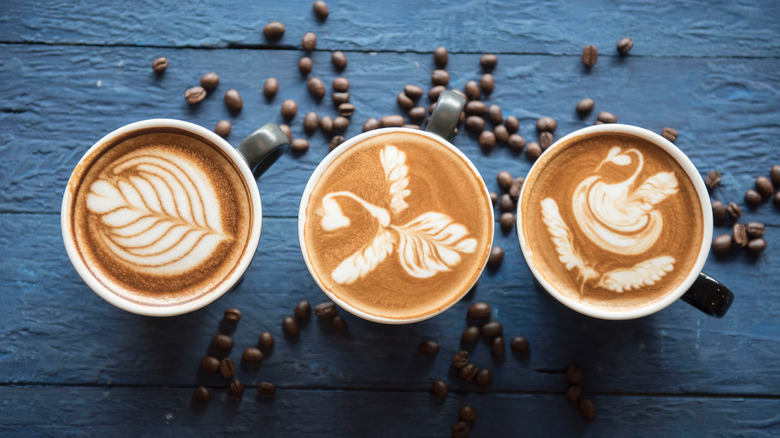 Three cups of latte art