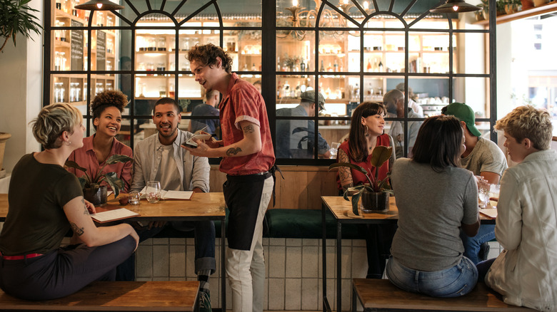 Server takes an order at a restaurant