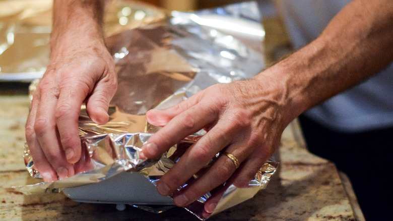 aluminum foil covering casserole dish