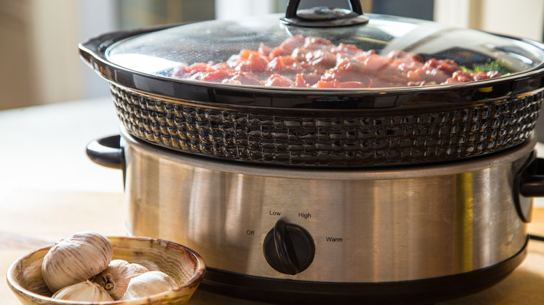 Slow cooker with food inside