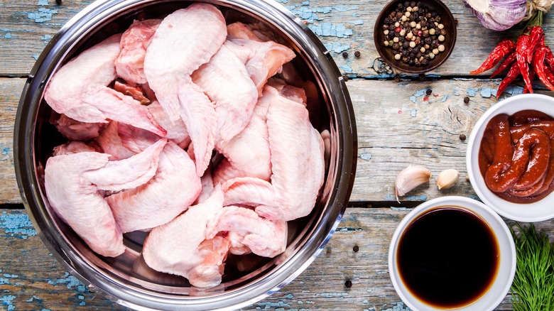 Raw chicken wings with marinade