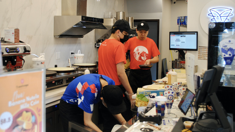 cooks preparing crepes t swirl