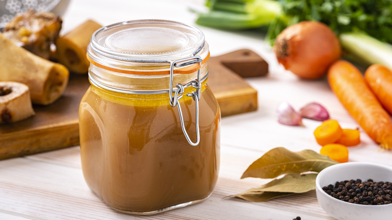 Jar of soup cooling on a counter