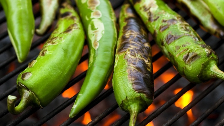 Roasted jalapeños on grill