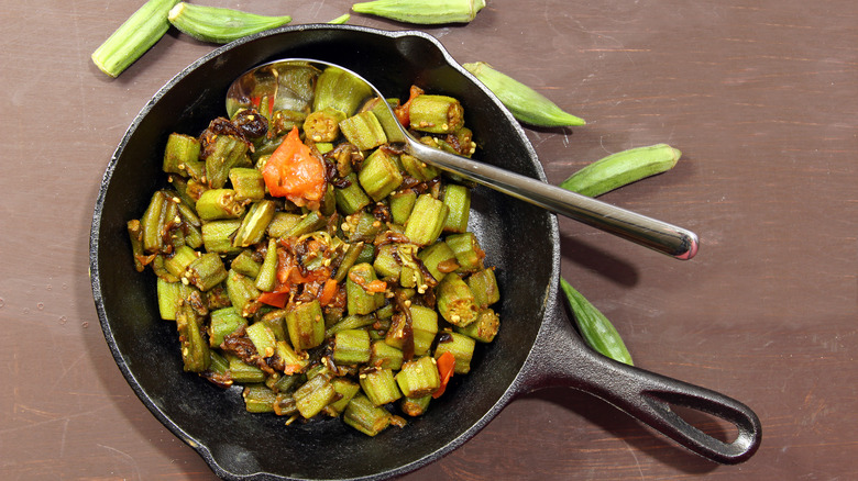 sauteed okra in an iron skillet