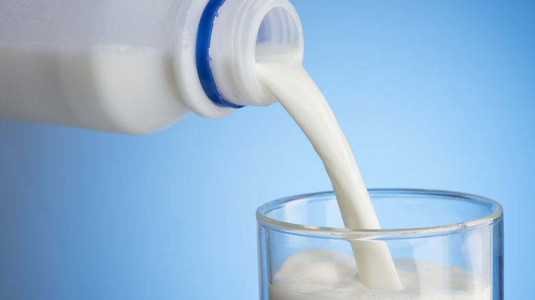 pouring a glass of milk