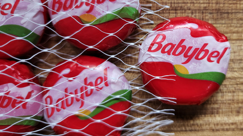 Babybell cheeses spilling out of net packaging