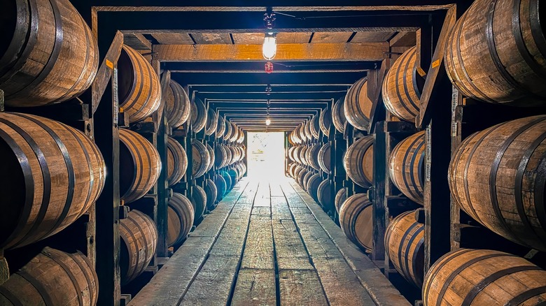 interior of a bourbon aging facility with barrels