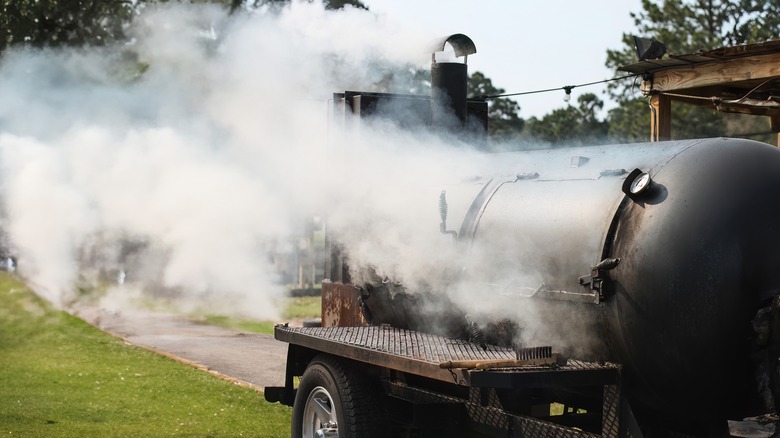 barbecue smoker emitting smoke 