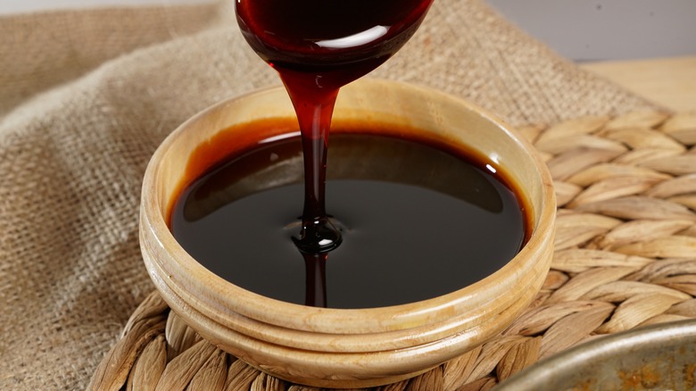 Molasses dripping into a bowl
