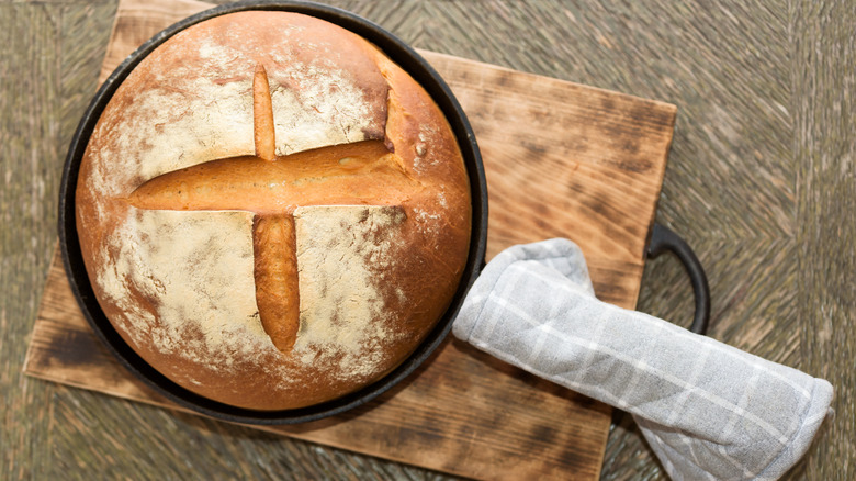 baked bread in skillet with covered handle