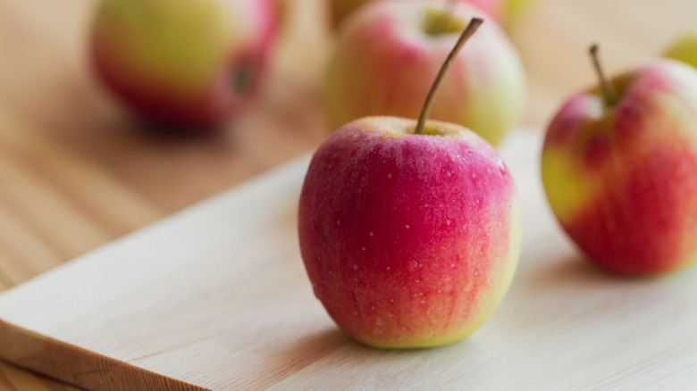 Fuji apple on cutting board