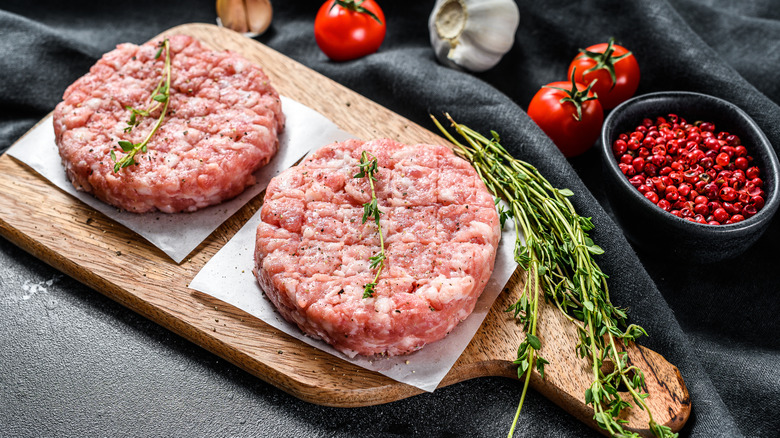 ground turkey patties on cutting board