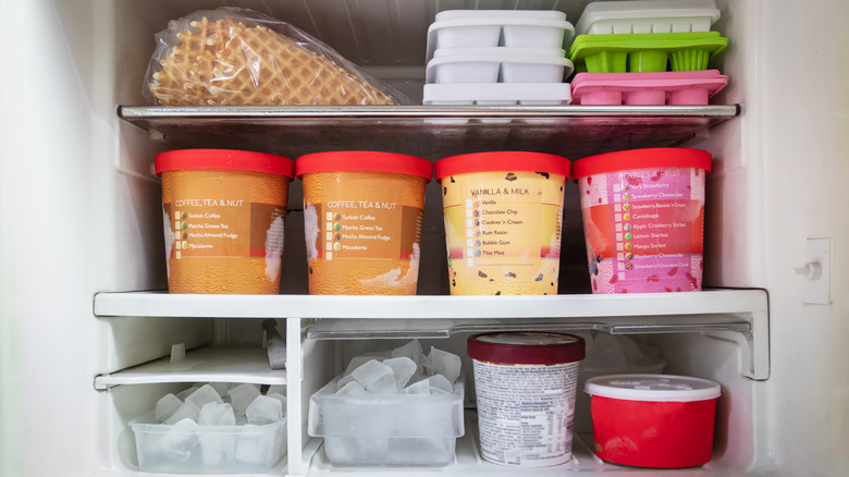 Open freezer with ice cream