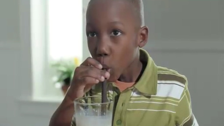 Boy sipping Oreo straw