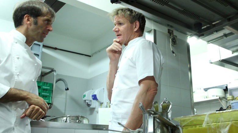 Gordon Ramsay talking with another chef