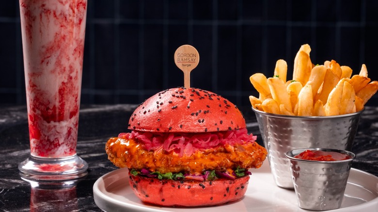 Fried chicken sandwich on a hot pink bun from Gordon Ramsay Burger at Flamingo Las Vegas