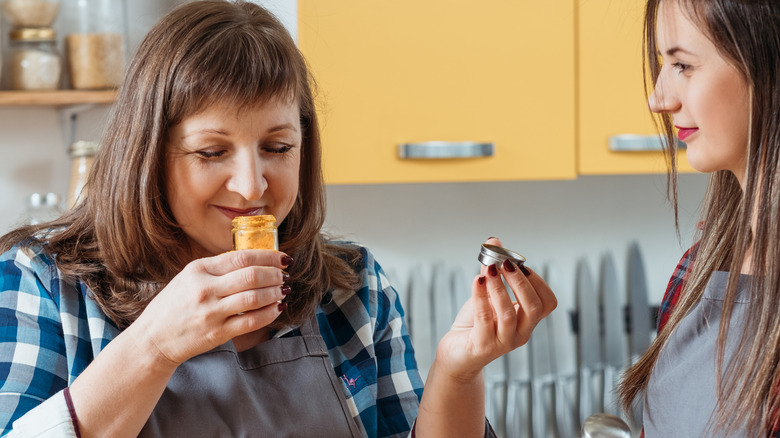 Woman smelling turmeric