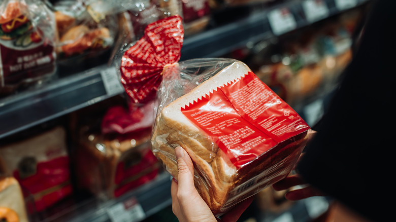 Person reading toast label in store