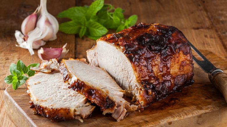 roasted pork loin on wooden board