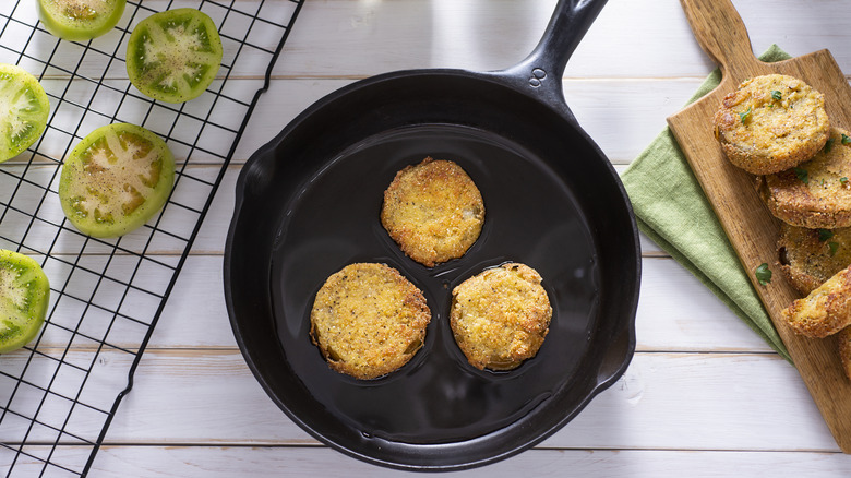 Fried green tomatoes in a skillet