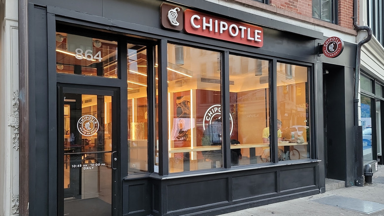 Chipotle storefront during open hours in the city