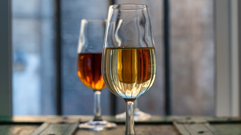 Two glasses of white and skin contact fortified wine