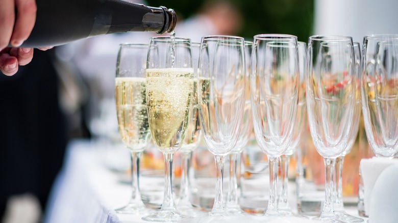 Waiter pouring sparkling wine 