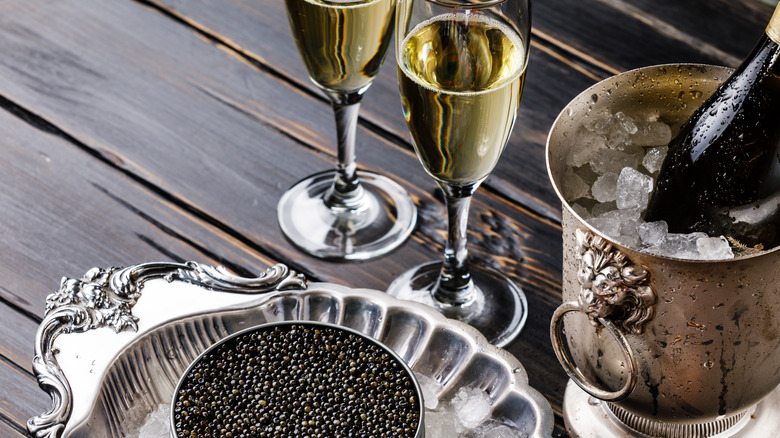 Champagne and caviar on table