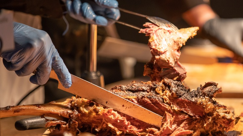 Chef slicing brisket