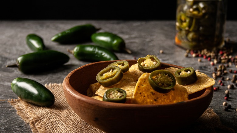 sliced jalapeños on nacho bowl