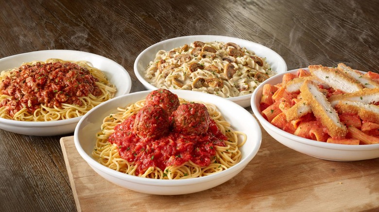 bowls of different Olive Garden pasta