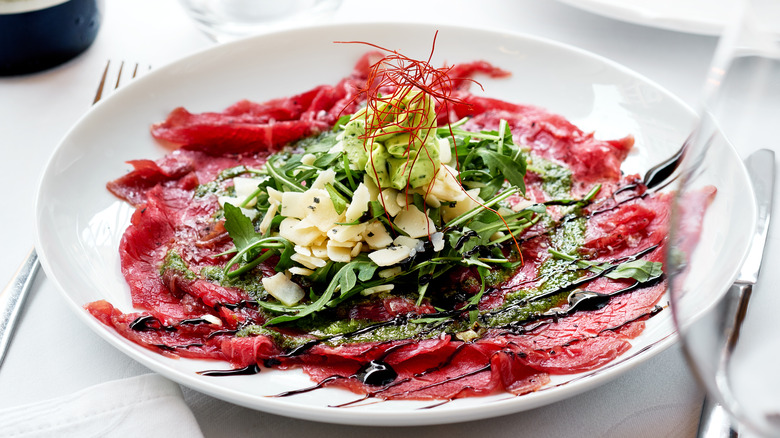 Beef carpaccio with greens