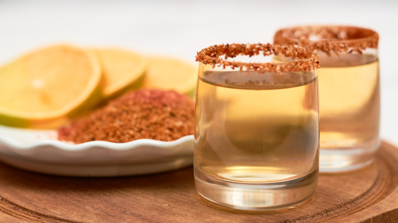 Two glasses of mezcal with chili rim