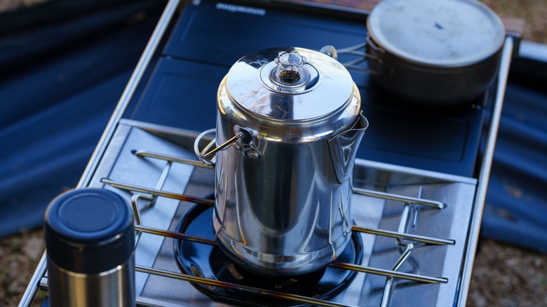 percolator on a camping stove outdoors