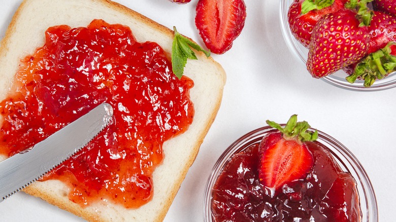 strawberry jam in a jar and on bread