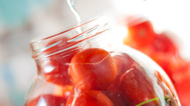 pouring water in mason jar