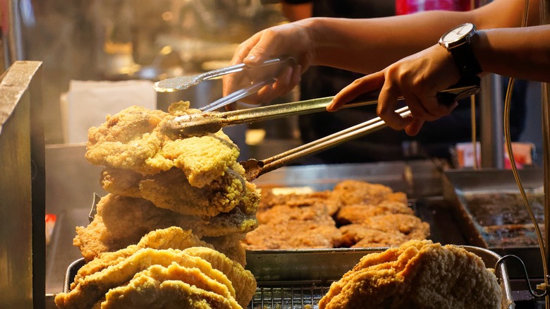 Street food vendor selling fried chicken