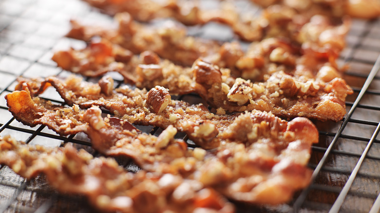 Candied bacon cooling on wire rack