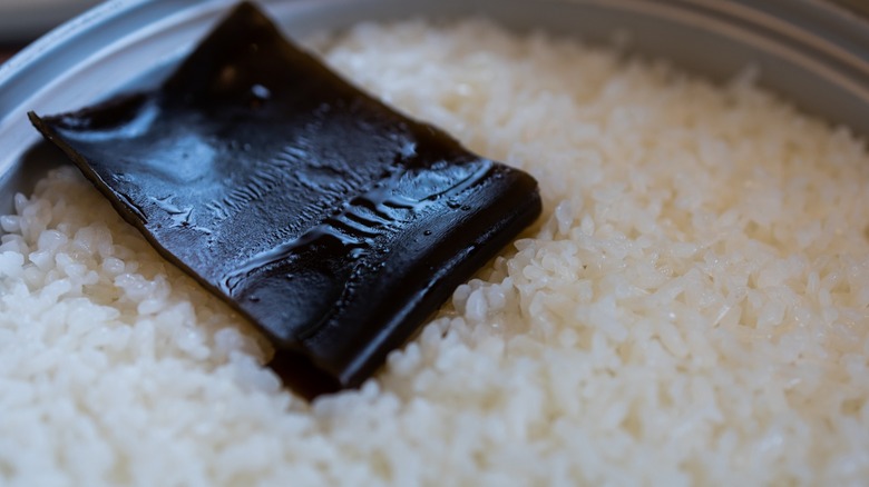 Close-up of a piece of kombu in cooked sushi rice