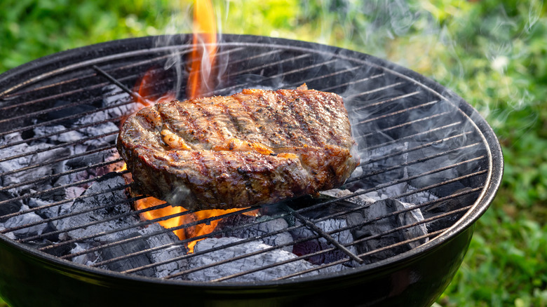 Steak on charcoal grill