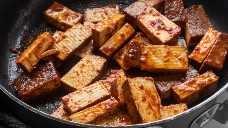 marinated tofu in a skillet