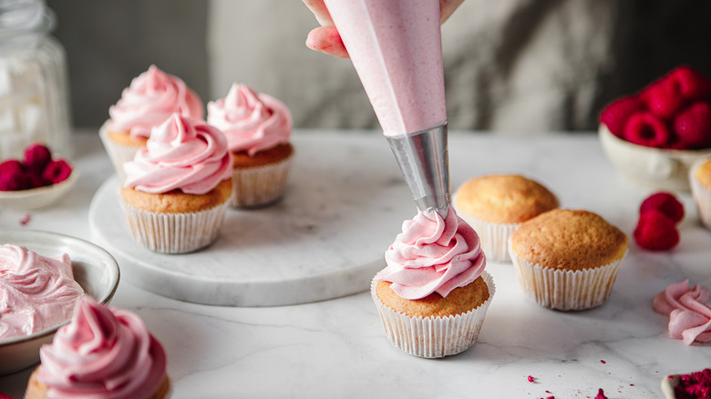 cupcakes decorated with pink icing