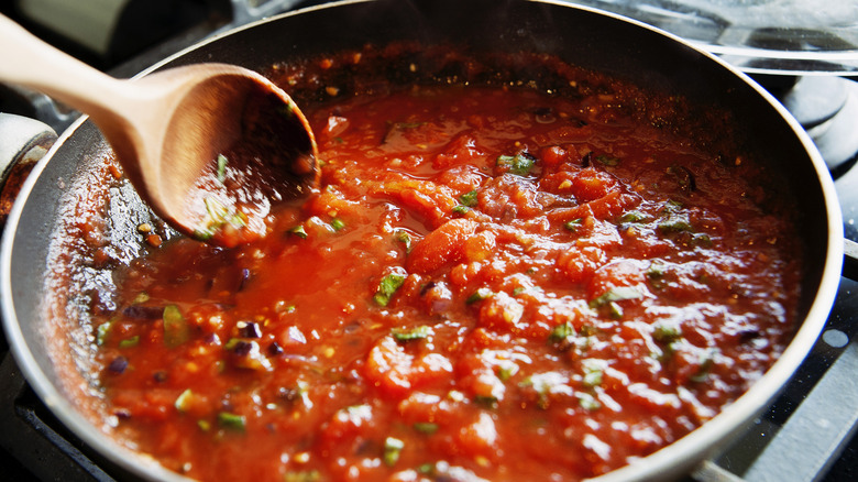 cooking tomato sauce in pan
