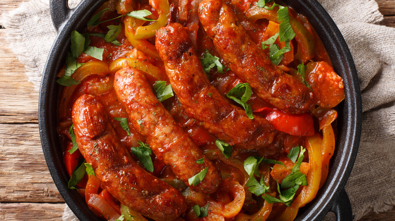 cooked sausage and peppers in a pan