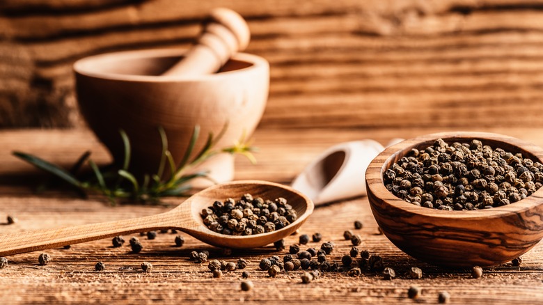 Black peppercorns in a bowl