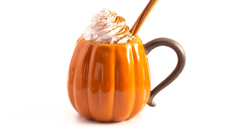 pumpkin spice latte in pumpkin shaped mug